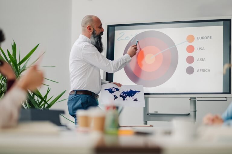 Businessman leading a presentation about global markets in the office